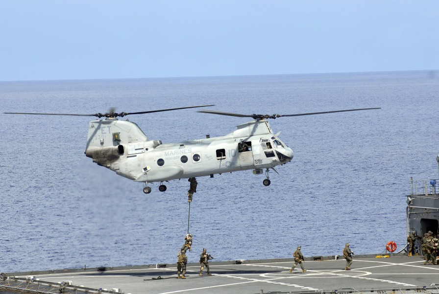 US Navy 100918-N-8335D-500 Marines assigned to the 31st Marine Expeditionary Unit (31st MEU) fast rope from a CH-46 Sea Knight helicopter onto the 