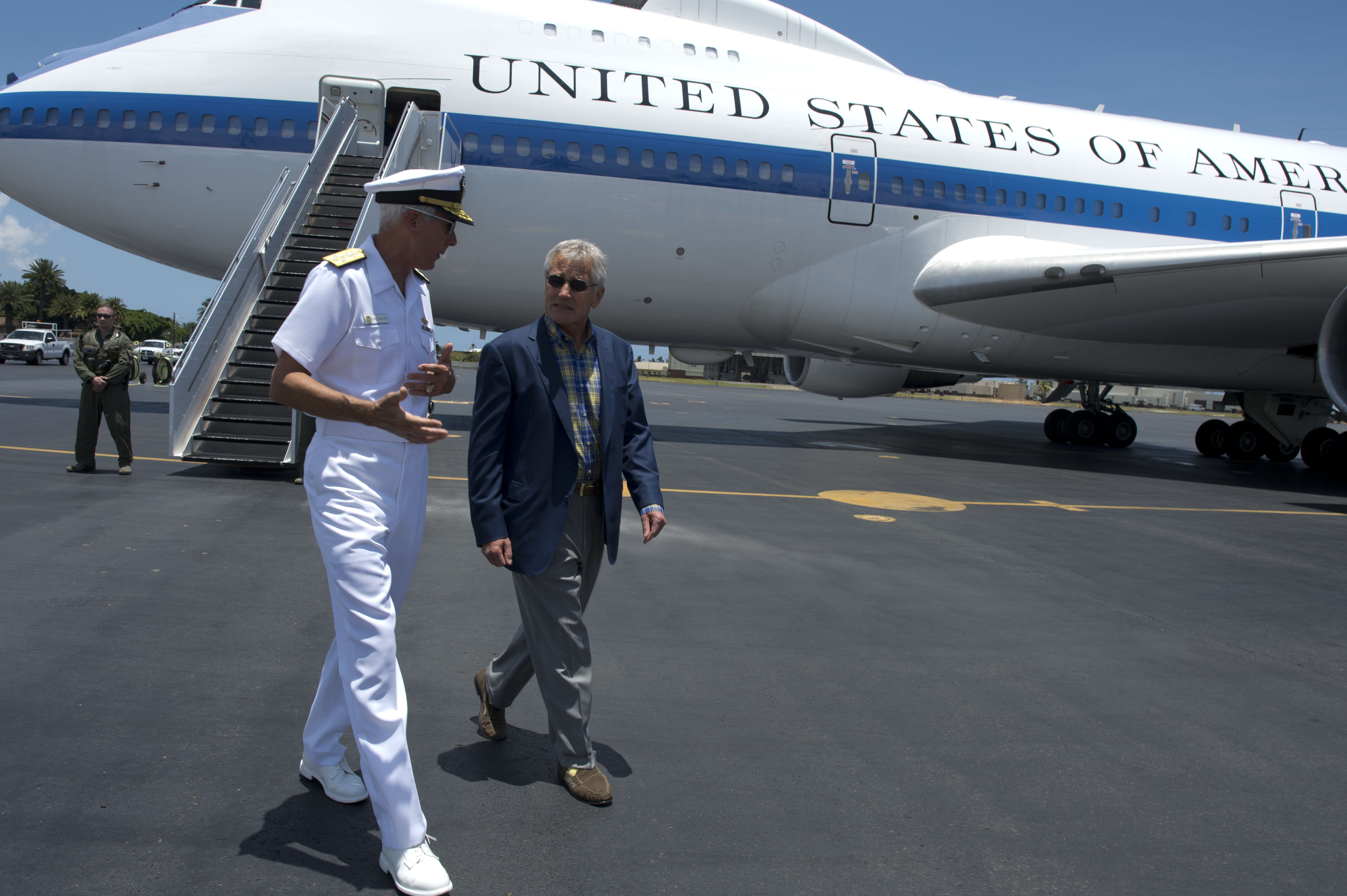 Secretary of Defense Chuck Hagel walks with Navy Admiral Samuel Locklear