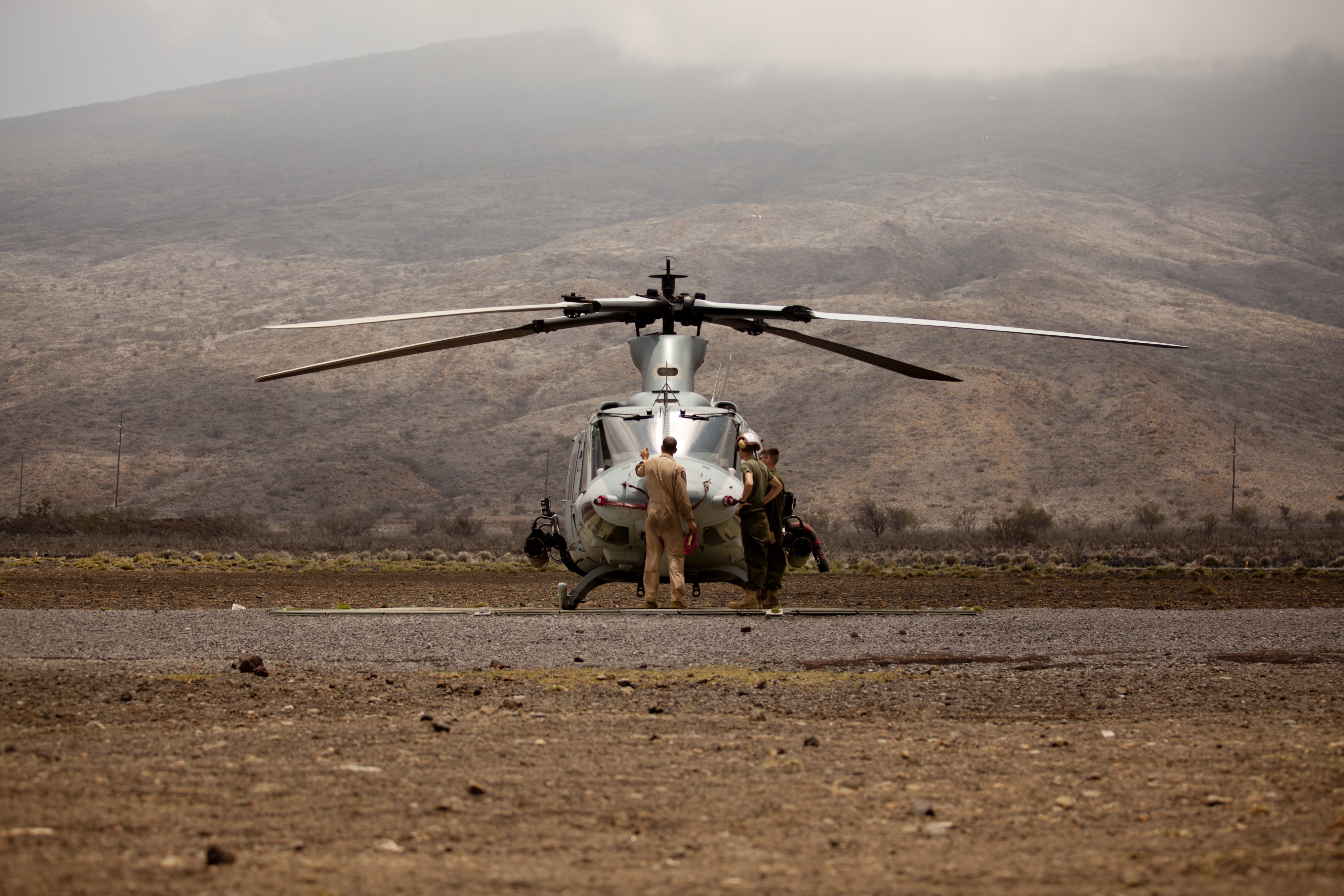 U.S. Marines with Marine Light Attack Helicopter Squadron 367 (HMLA-367) conducts maintenance inspections on a UH-1Y helicopter at Pohakuloa Training Area (PTA), Hawaii, May 10, 2013 130510-M-SD704-054