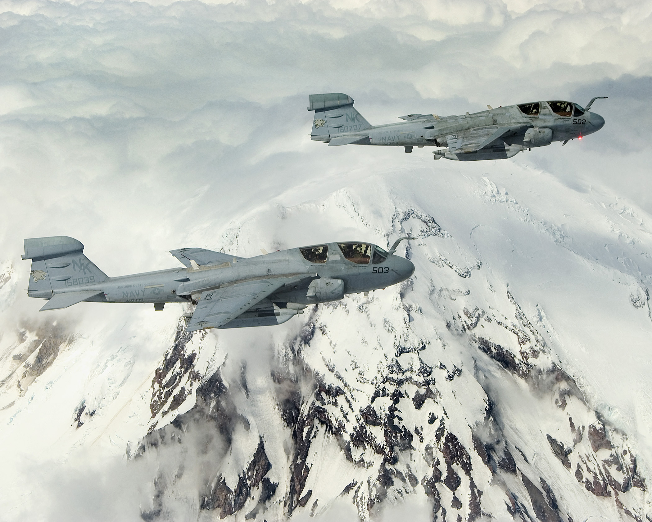 US Navy 040519-N-6436W-006 Two EA-6B Prowlers assigned to the Cougars of Electronic Attack Squadron One Three Nine (VAQ-139) fly in formation around Washington's Mount Rainier