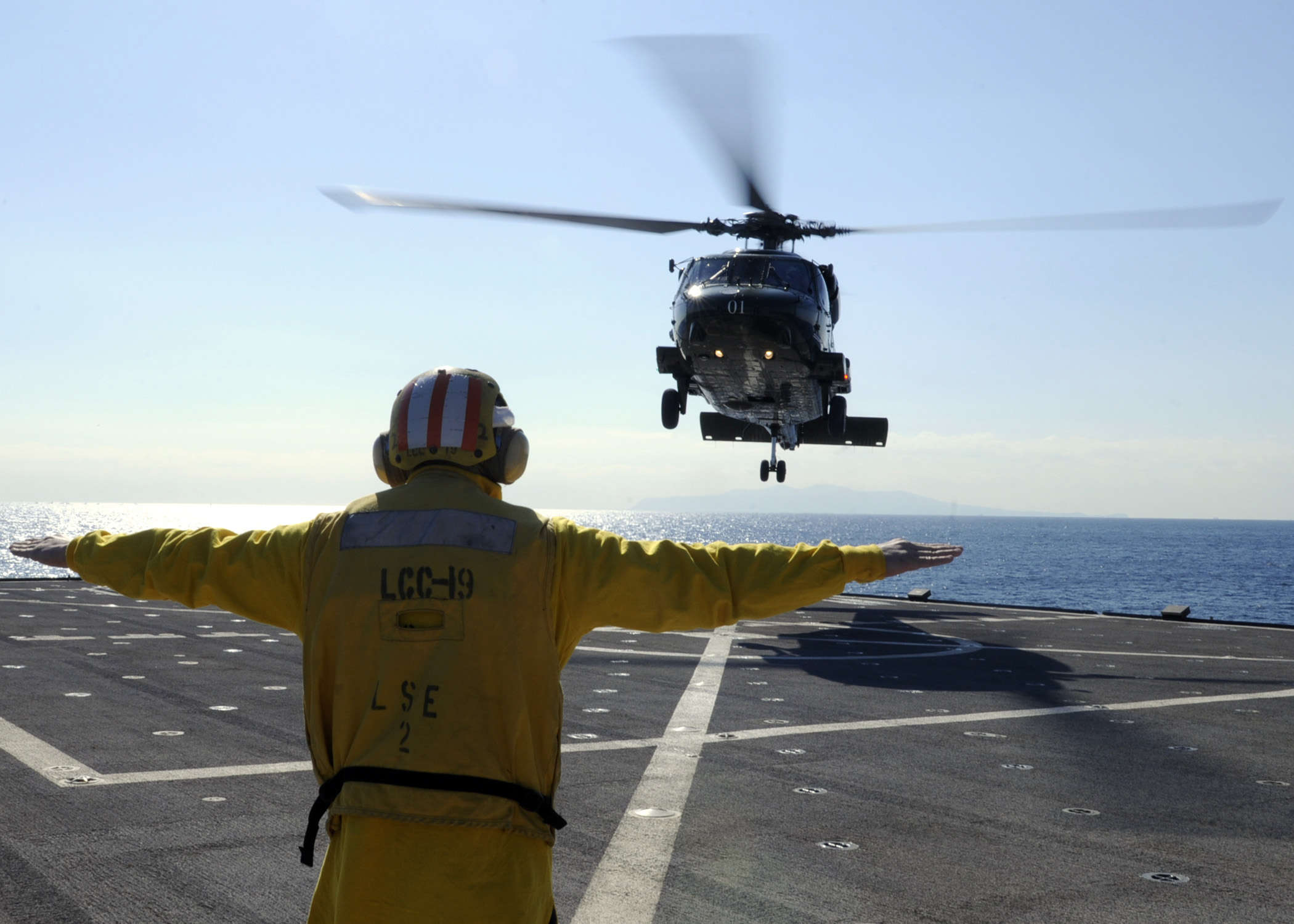 US Navy 100126-N-7478G-167 Seaman Drew Iverson launches an SH-60F Sea Hawk helicopter aboard the U.S. 7th Fleet command ship USS Blue Ridge (LCC 19)