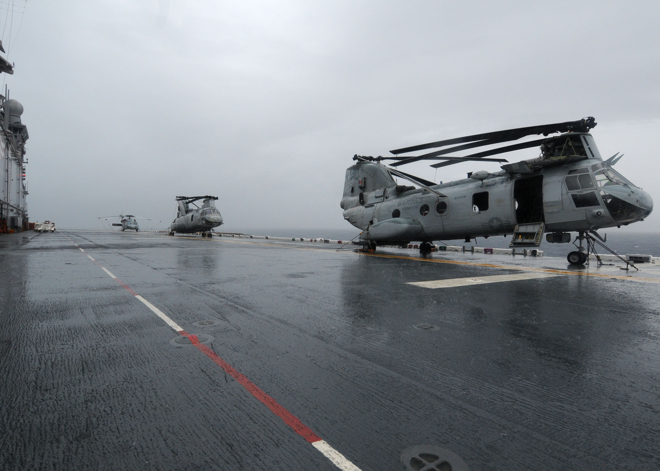 US Navy 101105-N-3265K-034 CH-46E helicopters are secured on the flight deck of the multi-purpose amphibious assault ship USS Iwo Jima (LHD 7)