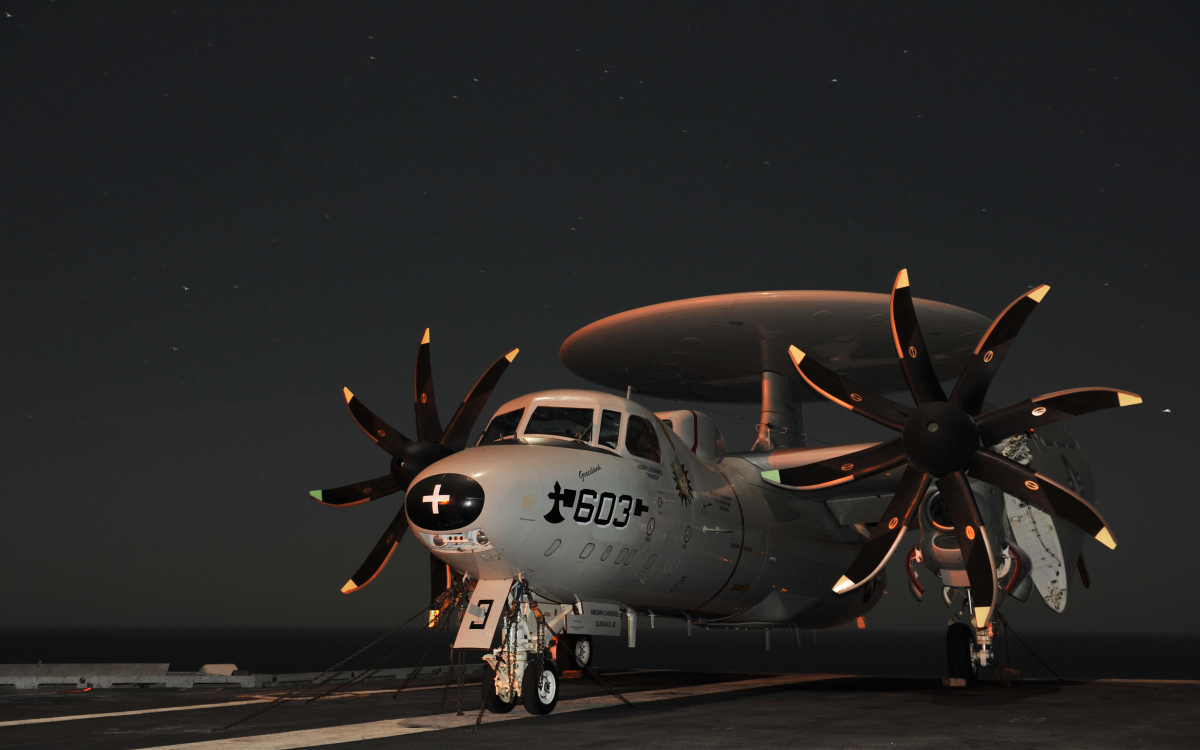 US Navy 101219-N-5016P-002 An E-2C Hawkeye is chained to the flight deck aboard USS Abraham Lincoln (CVN 72)