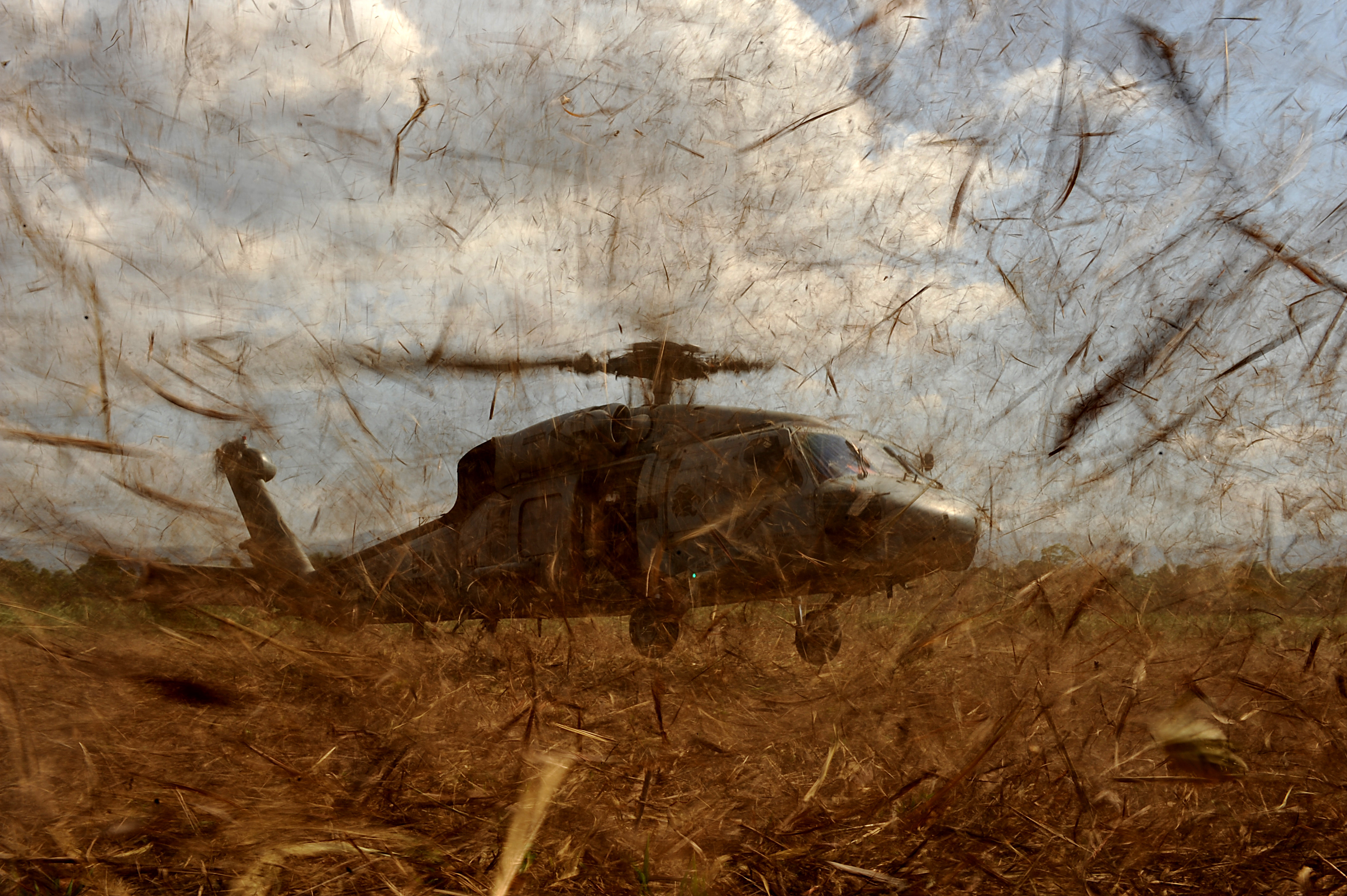 US Navy HH-60 picks up military personnel in Haiti