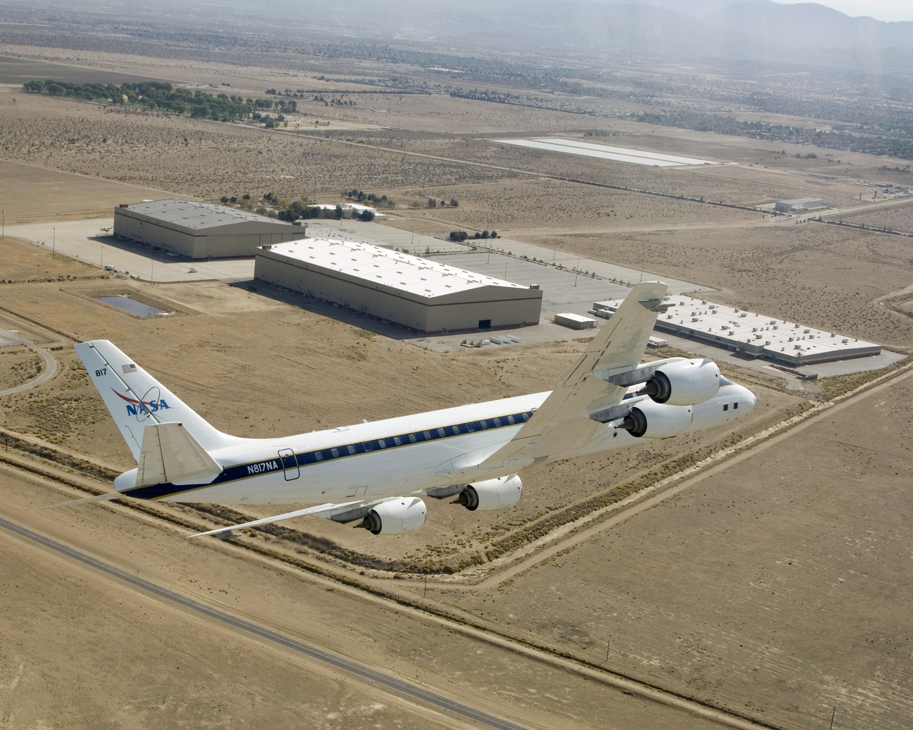 DC-8 banked over Dryden Aircraft Operations Facility