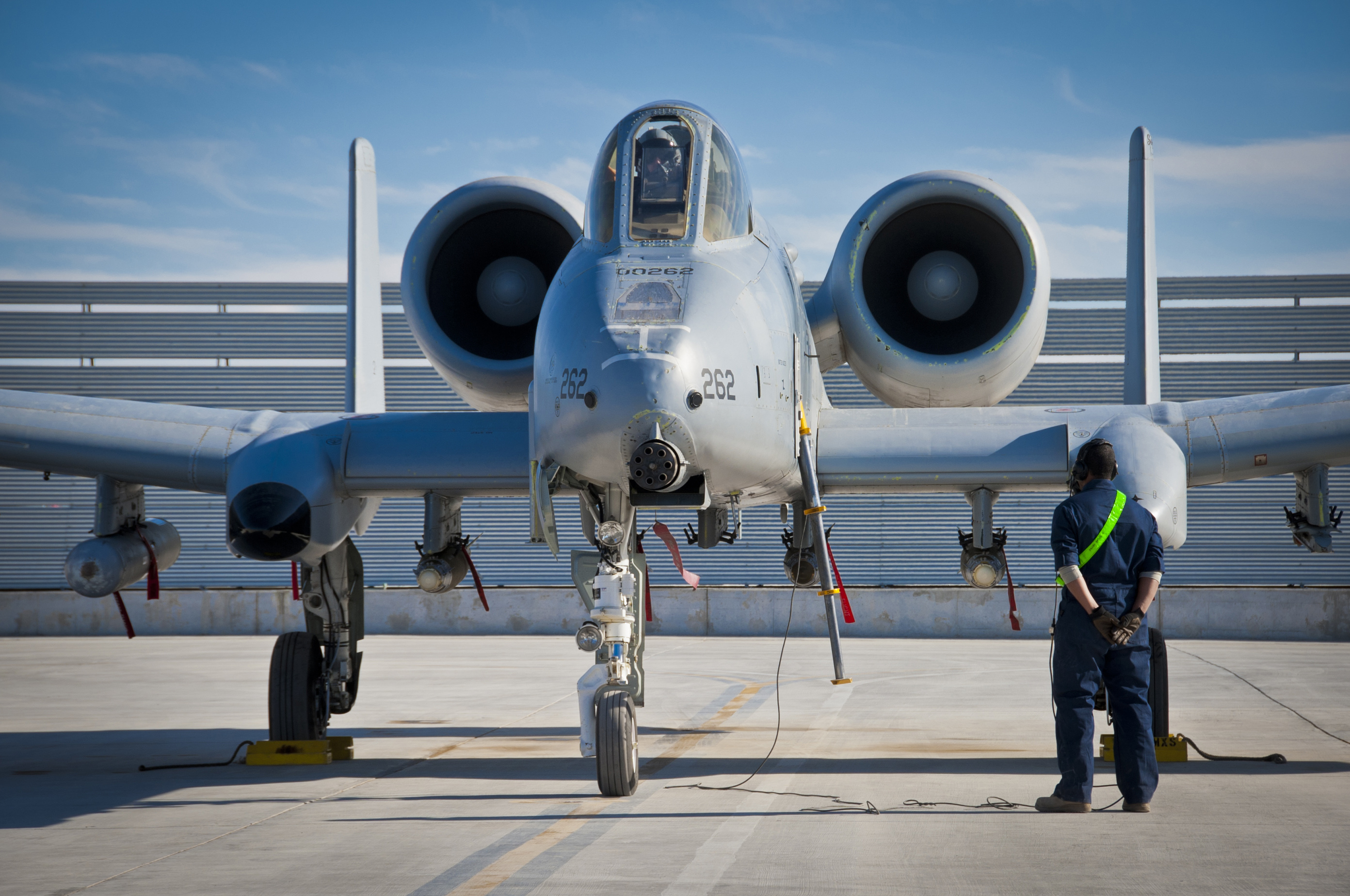 Defense.gov News Photo 120120-F-XH170-115 - A 451st Expeditionary Aircraft Maintenance Squadron crew chief waits for the pilot s call to pull the chocks during an A-10 Thunderbolt II aircraft
