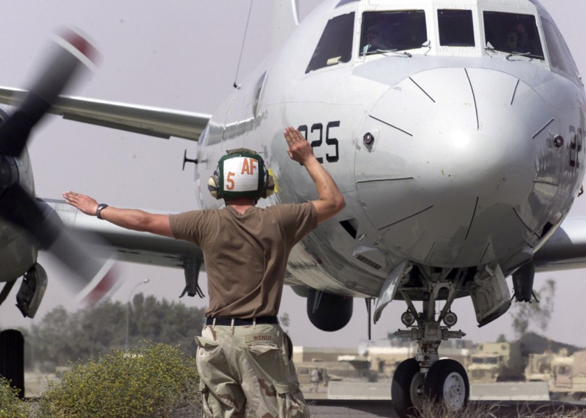 US Navy 030411-N-8921O-003 Aviation Structural Mechanic Airman Frank Wendt signals a right turn for a P-3C Orion