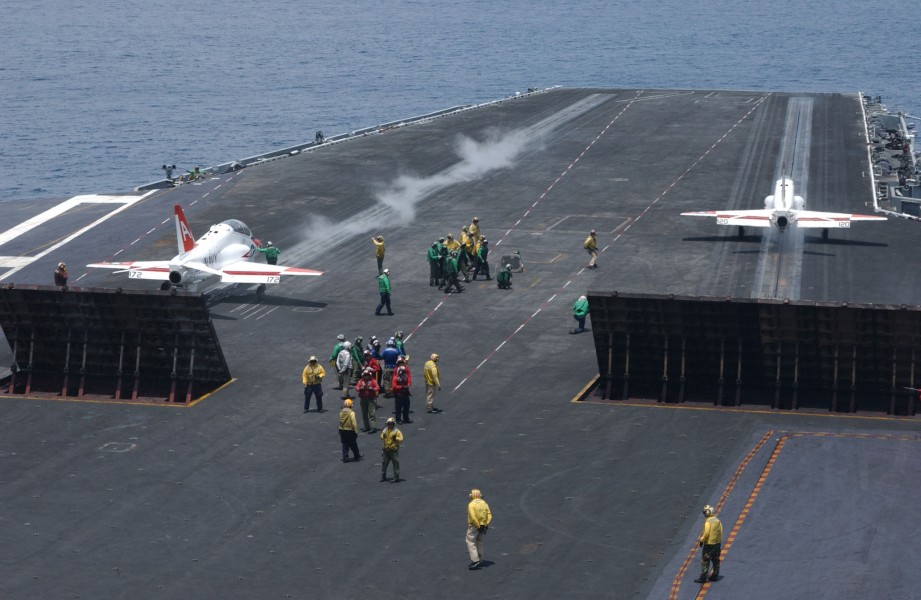 US Navy 030713-N-1350S-006 Two T-45C Goshawks assigned to Fixed Wing Training Squadron Seven (VT-7) prepare to take off from flight deck of USS Harry S. Truman (CVN 75)