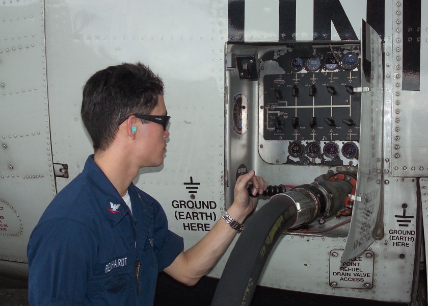 US Navy 040226-N-8055R-080 Aviation Machinist Mate 3rd Class Jeremy Reinhardt, of Pacifica, Calif., conducts a refueling operations on a C-130T Hercules