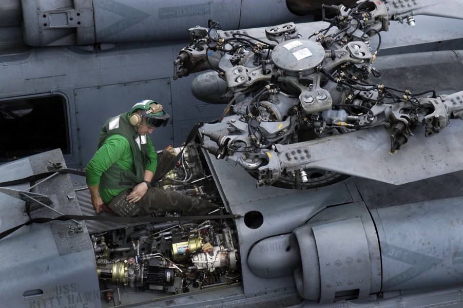 US Navy 050525-N-0167B-011 An Aviation Electronics Technician performs corrosion control on an HH-60H Seahawk helicopter