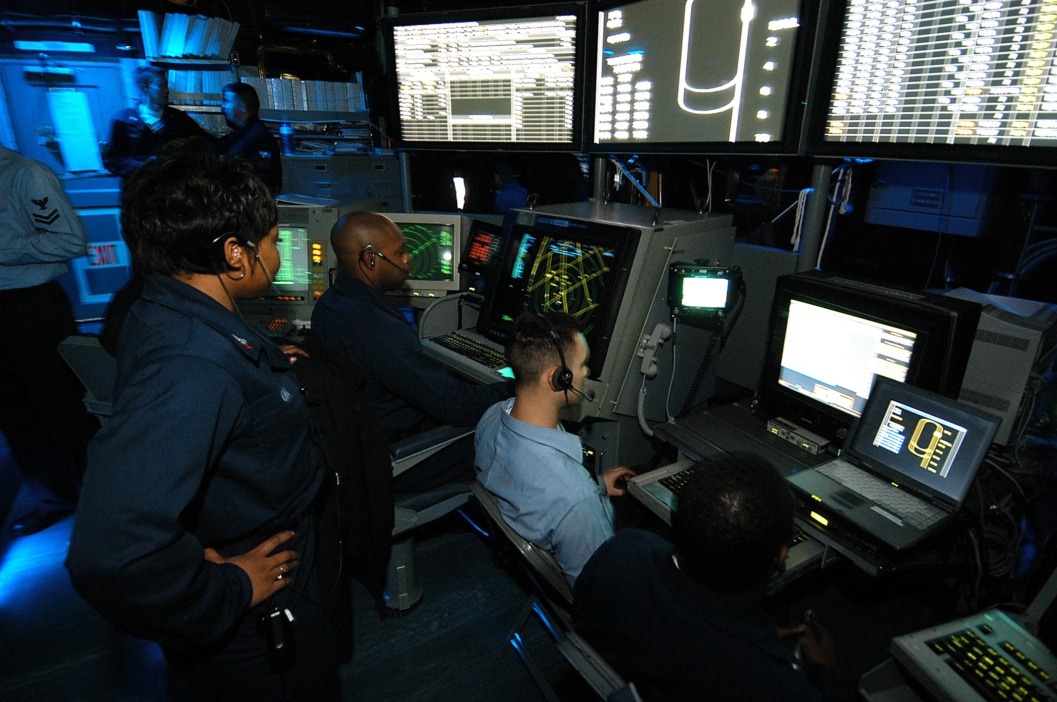 US Navy 031217-N-6278K-001 Air Traffic Controllers man the Carrier Air Traffic Control Center (CATCC) during flight operations aboard USS George Washington (CVN 73)
