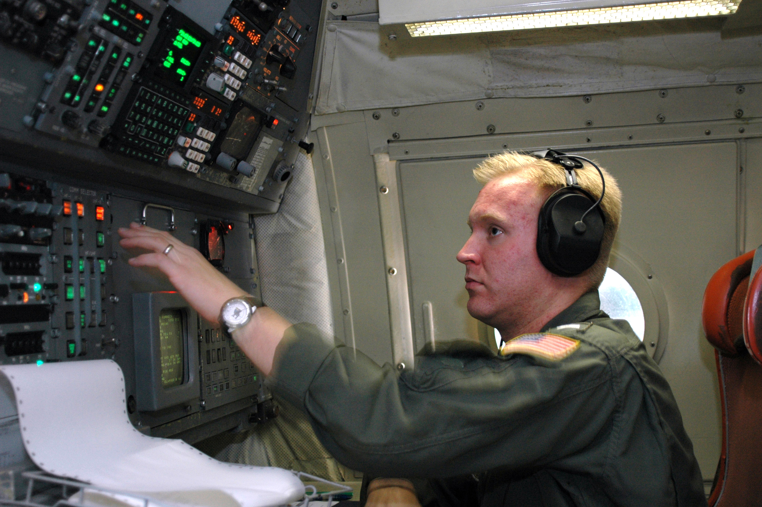 US Navy 060217-N-8726C-007 Lt. j.g. Matt Watson, assigned to the Tridents of Patrol Squadron Two Six (VP-26), makes pre-flight checks on his navigation and communication systems