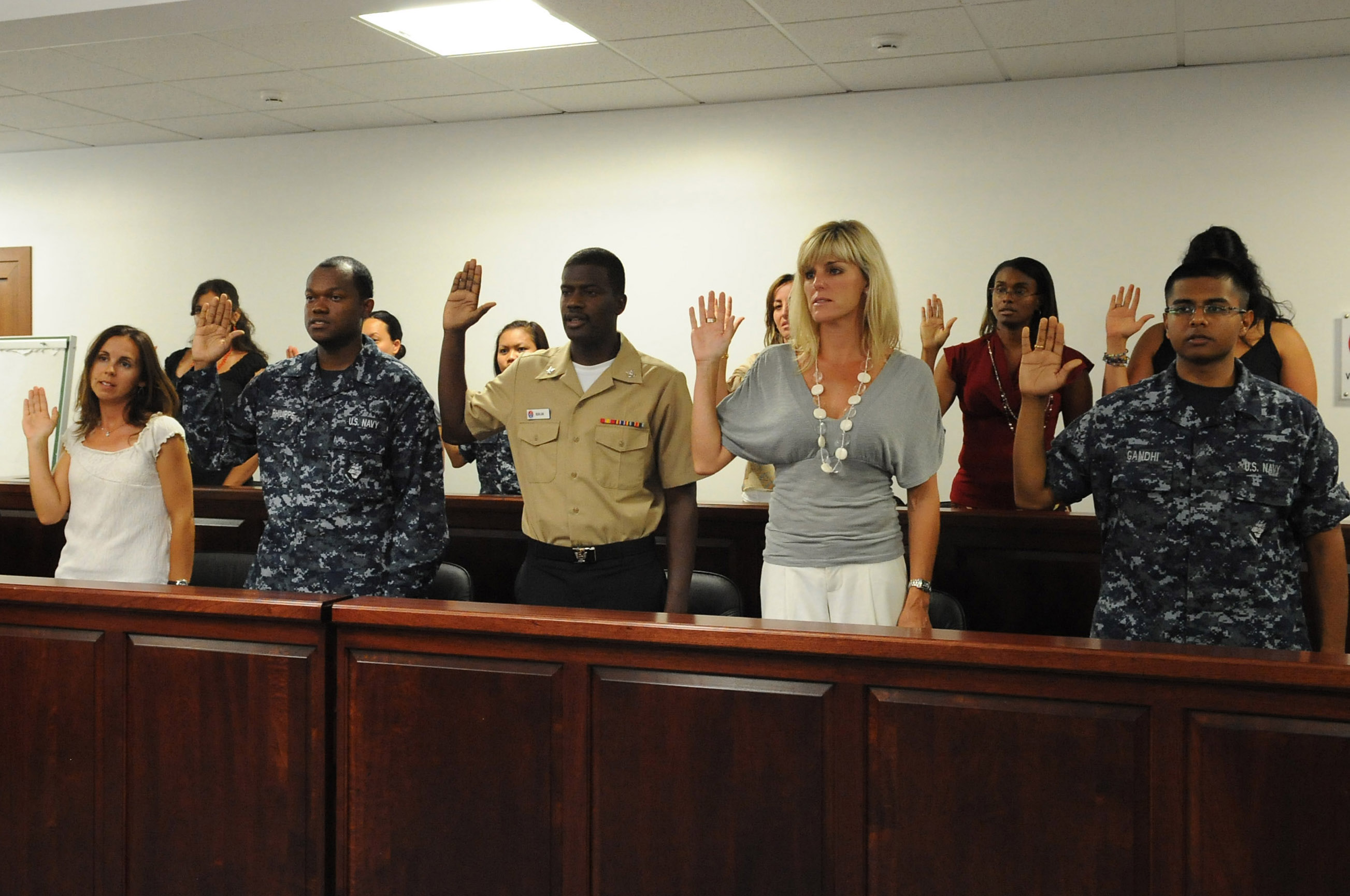 US Navy 100720-N-1938G-002 Candidates for U.S. citizenship recite the oath of citizenship during a naturalization ceremony at Naval Air Station Sigonella