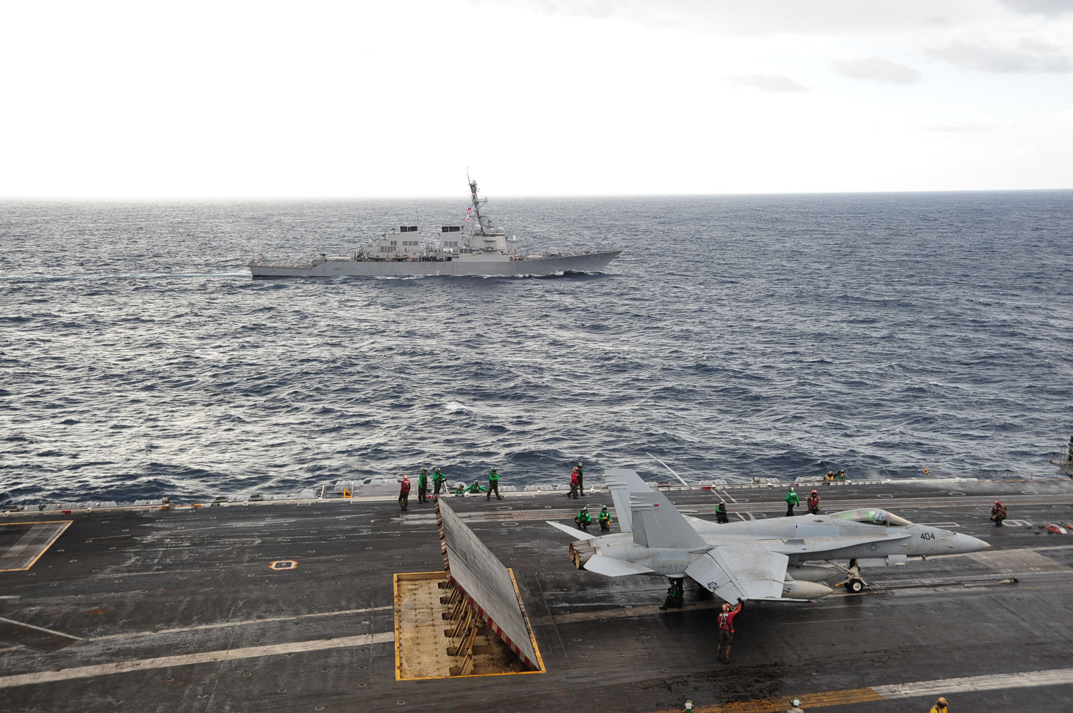 US Navy 101026-N-3418M-123 The aircraft carrier USS George Washington (CVN 73) conducts routine flight operations while the Arleigh Burke-class gui
