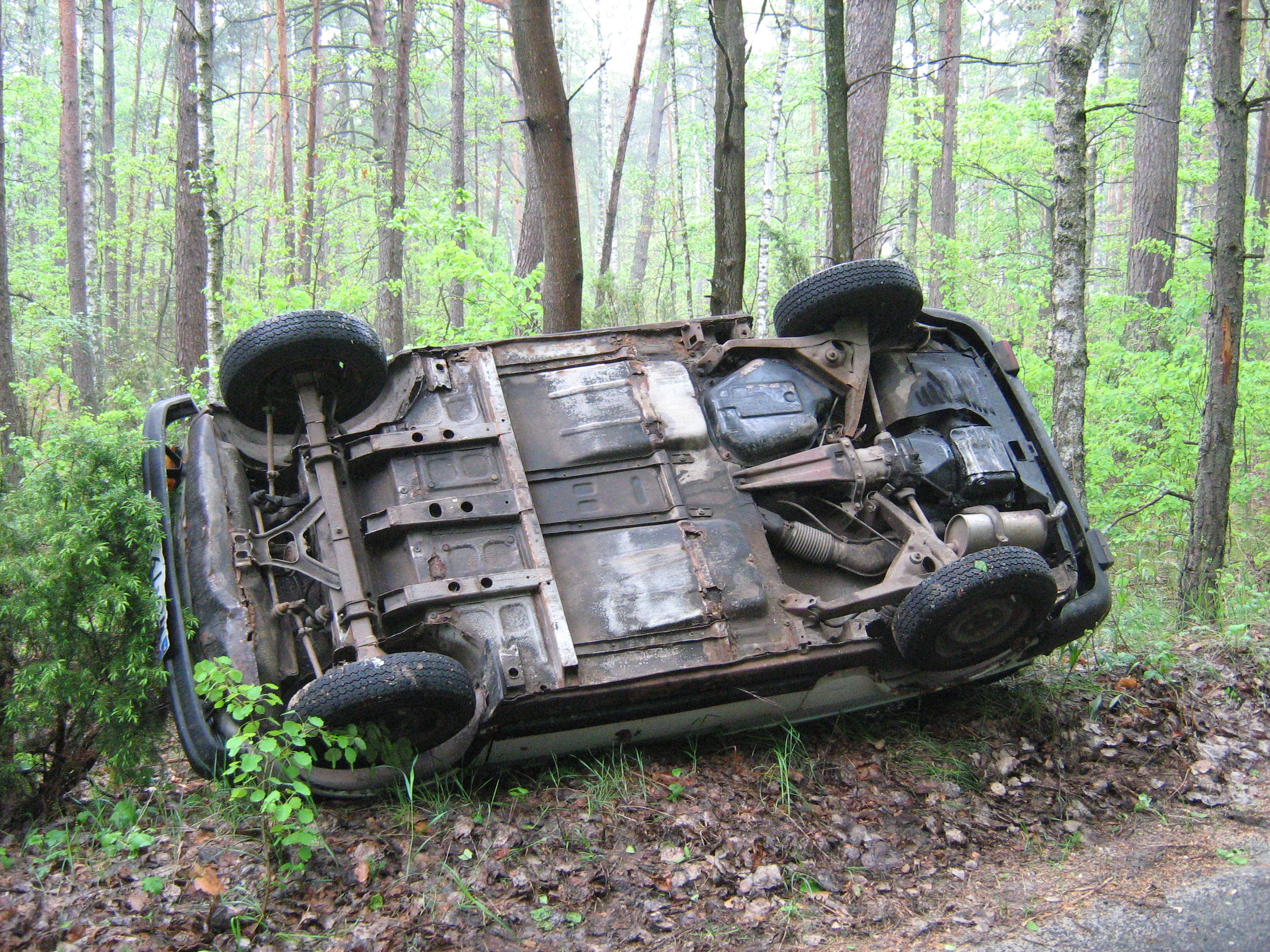 126p Polski Fiat on its side