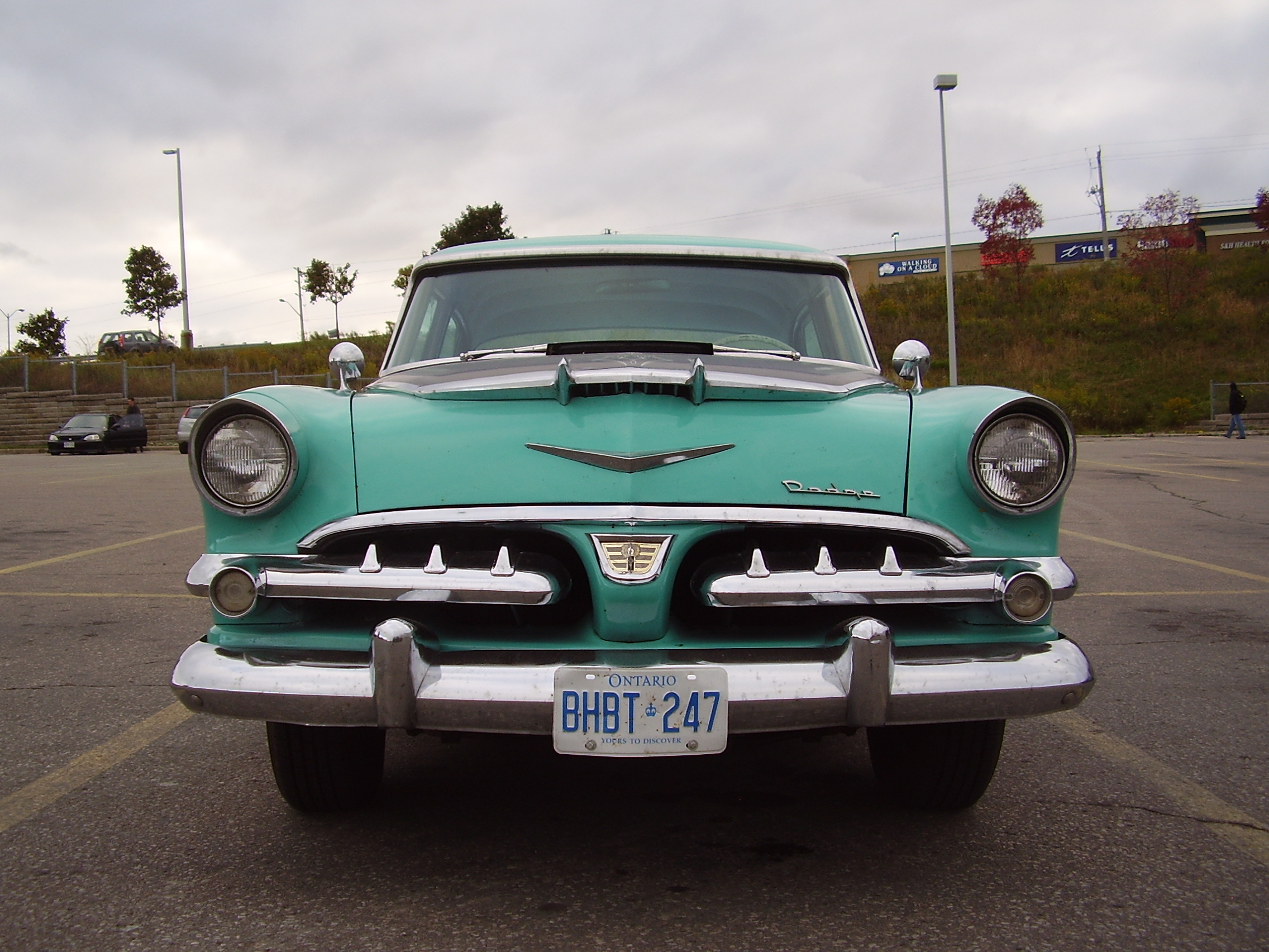 A mildly customized, two-toned black & turquoise Dodge Custom Royal