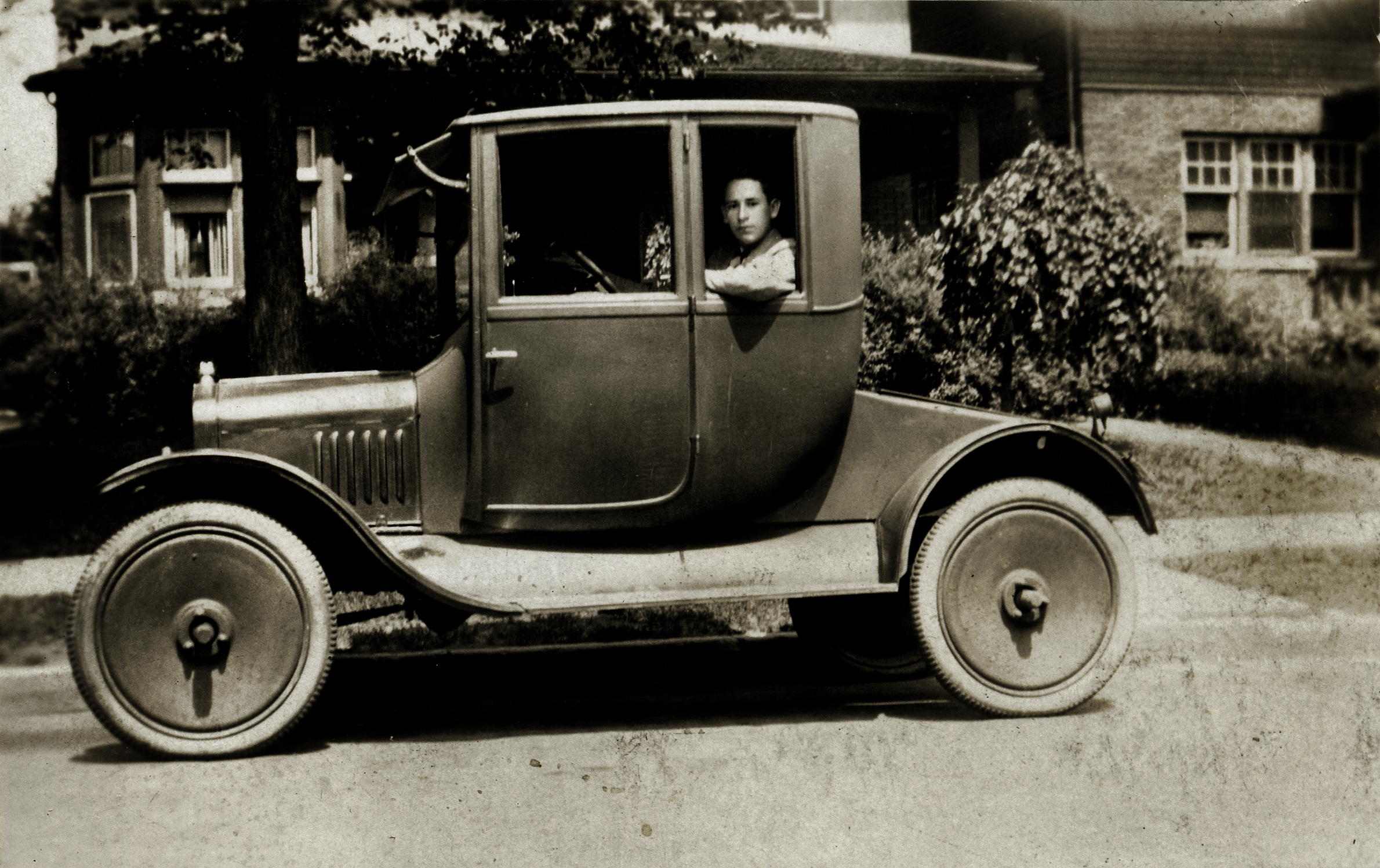 Grandpa's first car, Model T coupe,with artillery wheels Edward a O'D