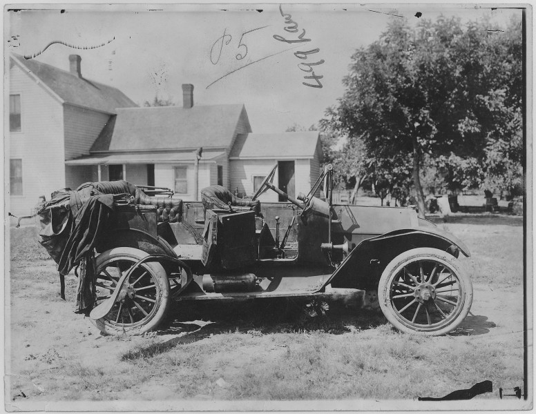 Open car parked in yard of house. Omaha - NARA - 283747