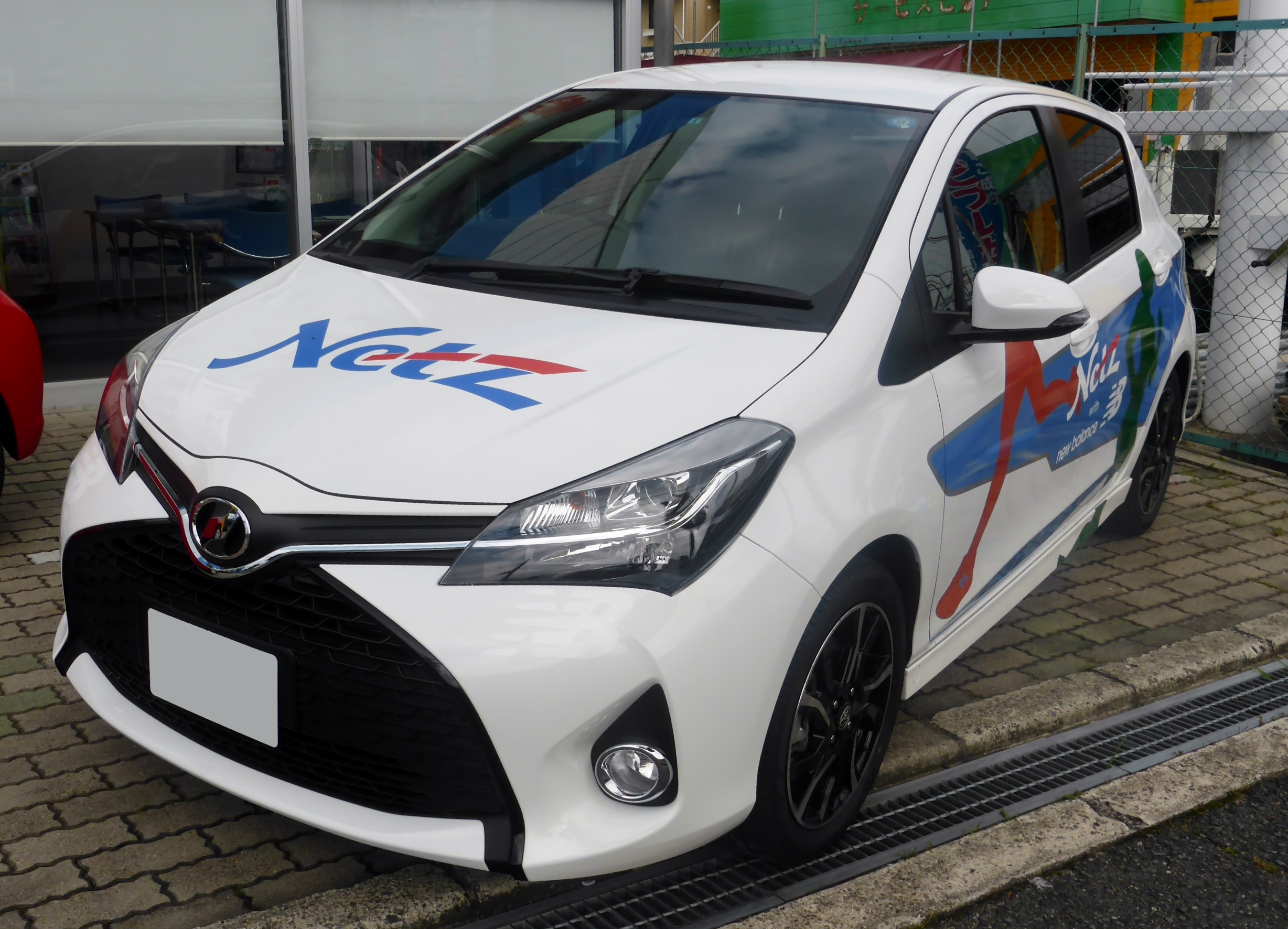 The frontview of Toyota Vitz 1.5RS (NCP131) Netz Toyota Nara with new balance