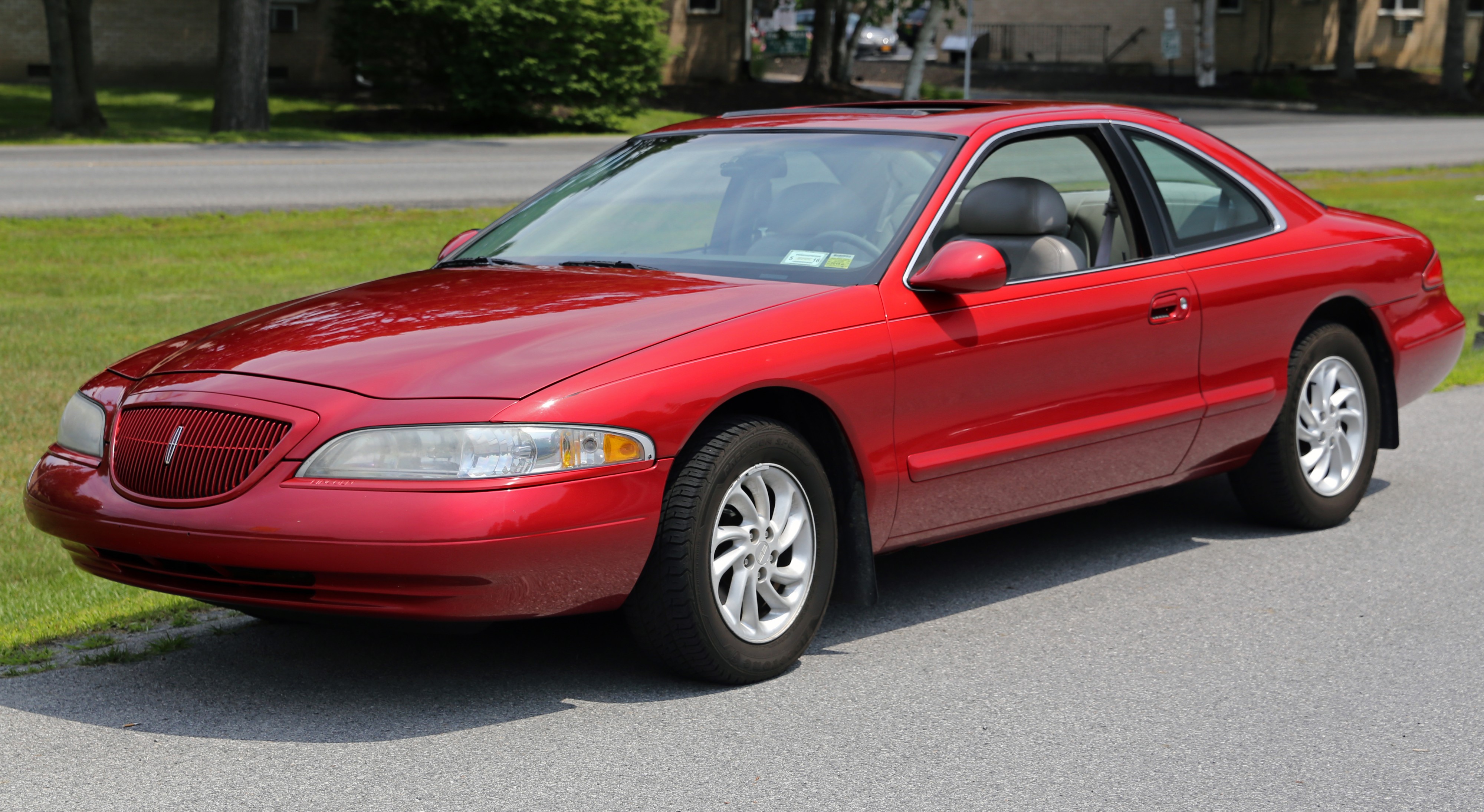 1998 Lincoln Mark VIII LSC in red, front left