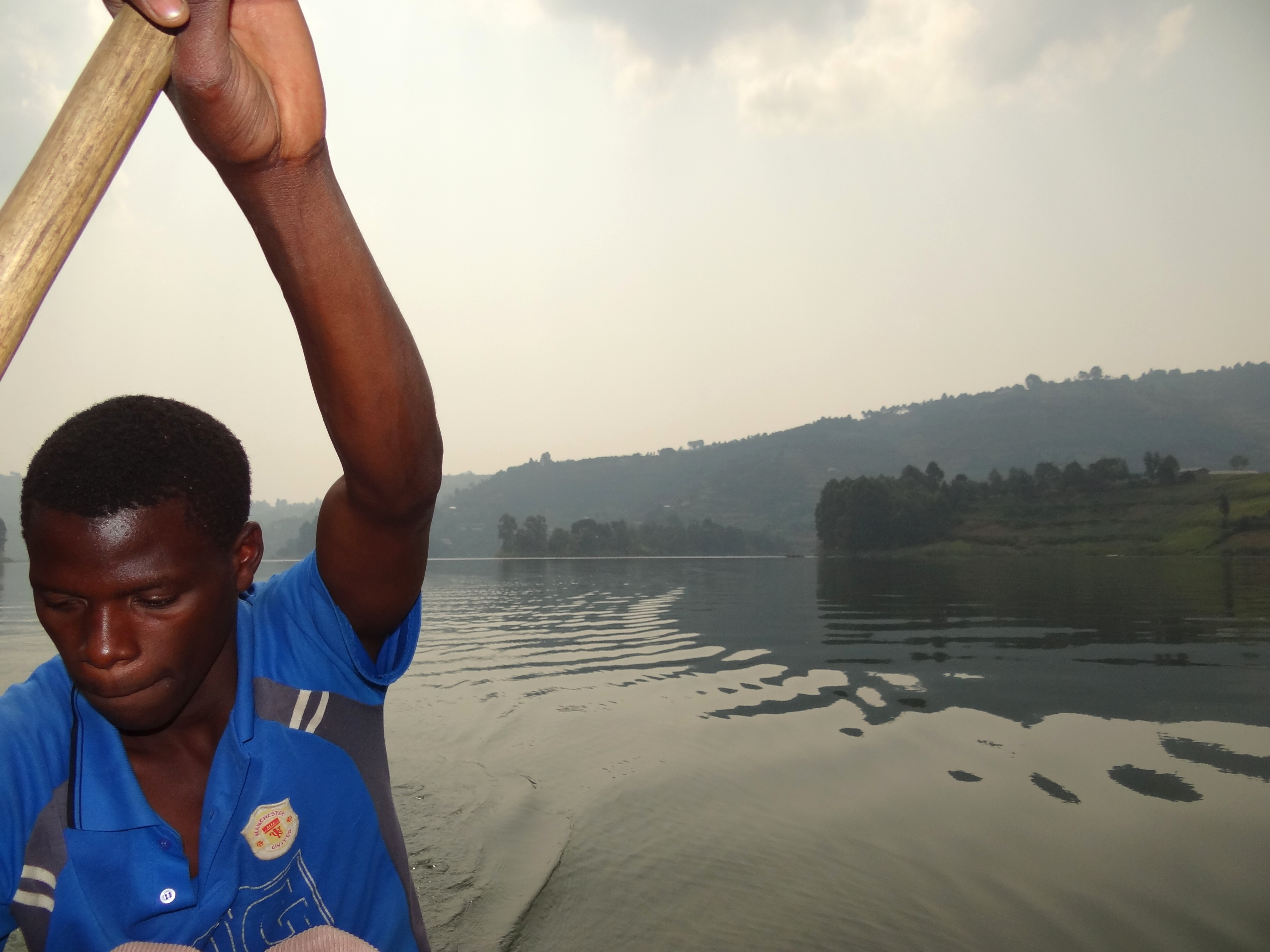 Boatsman Rows on Lake Bunyonyi - Southeastern Uganda