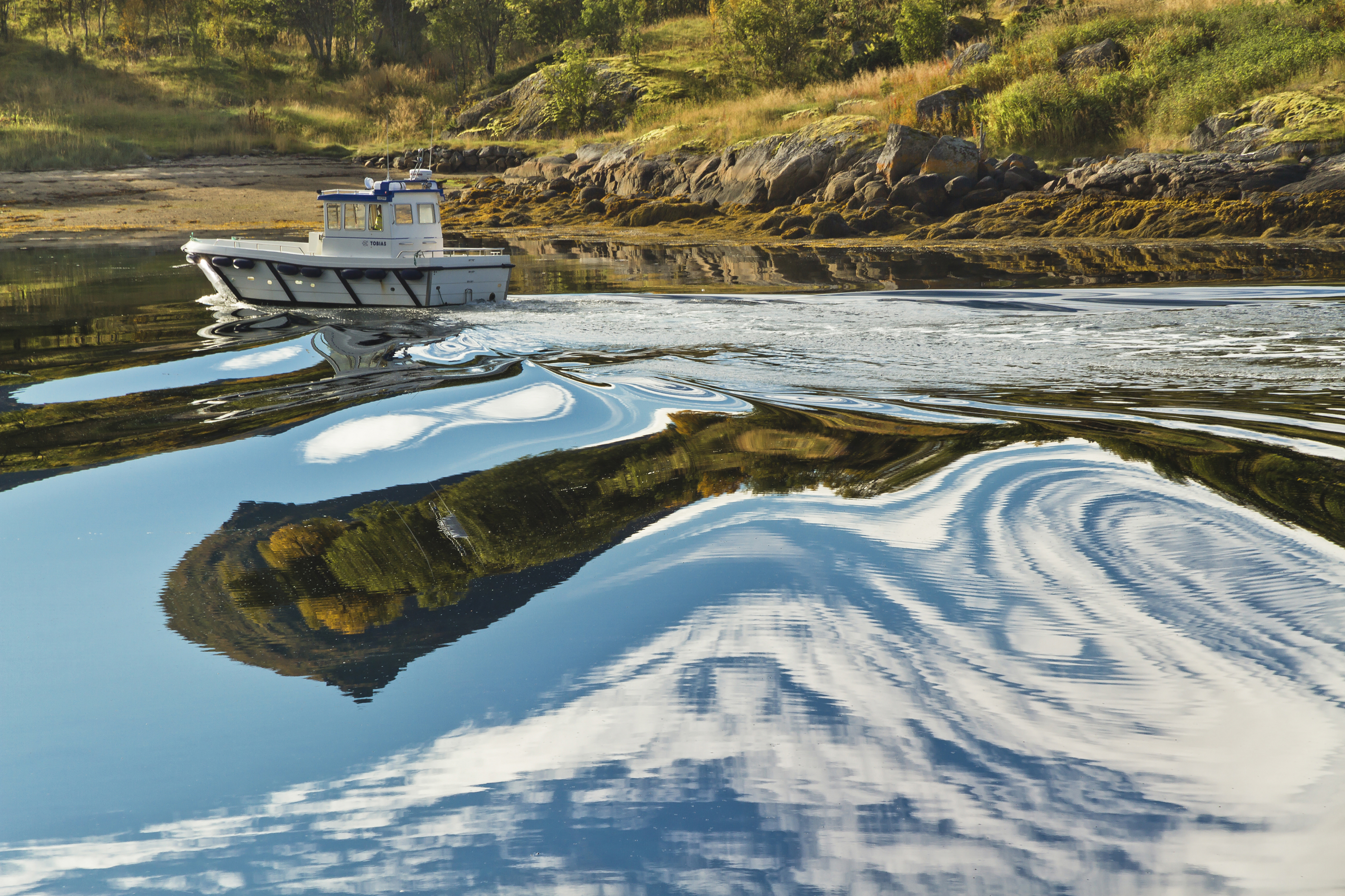 Distorting water reflections at Digermulen port, Hinnøya, Norway, 2015 September