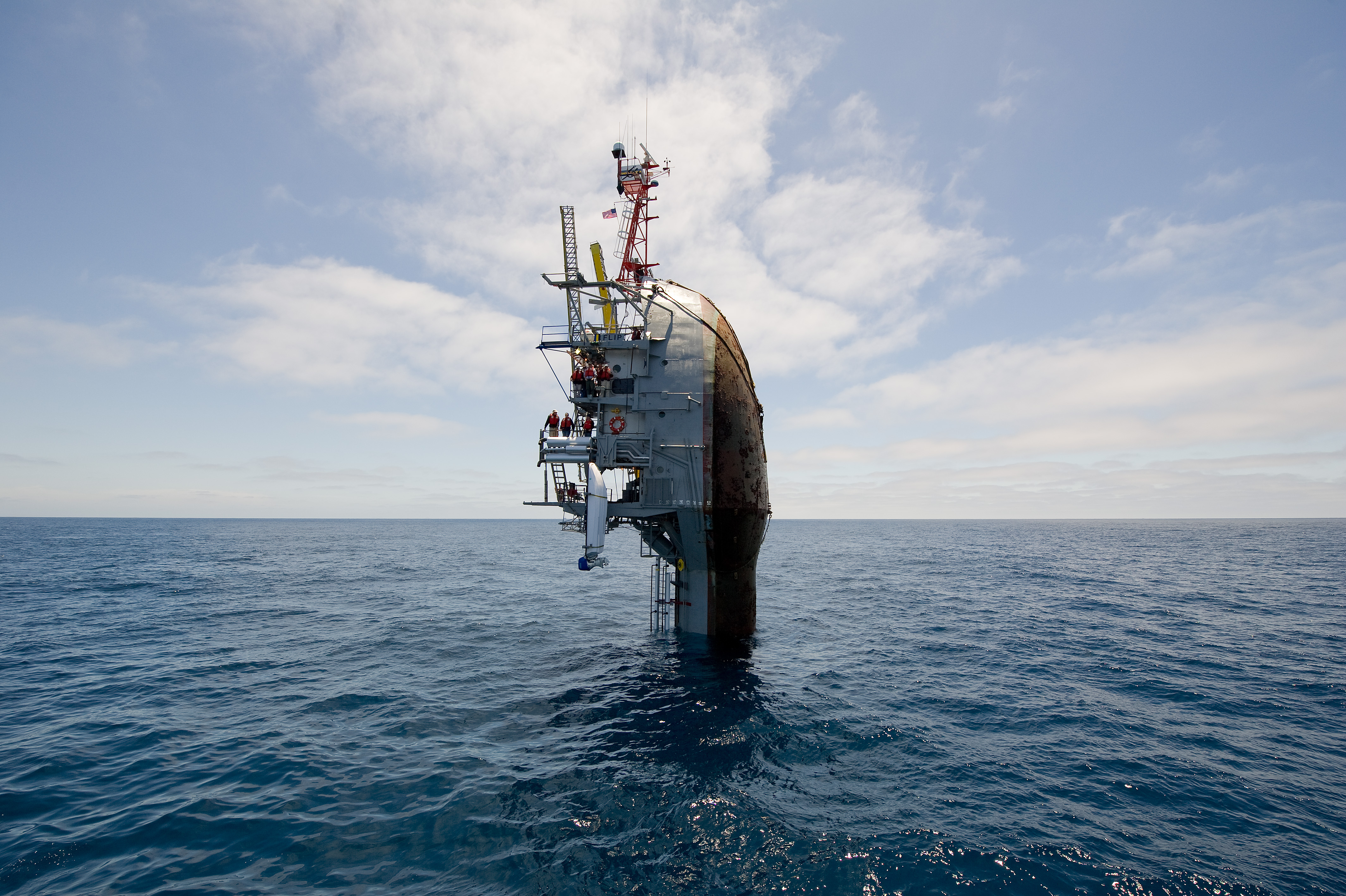 Flickr - Official U.S. Navy Imagery - 55 feet remain visible after the crew of the Floating Instrument Platform, or FLIP, partially flood the ballast tanks causing the vessel to turn stern first into the ocean.
