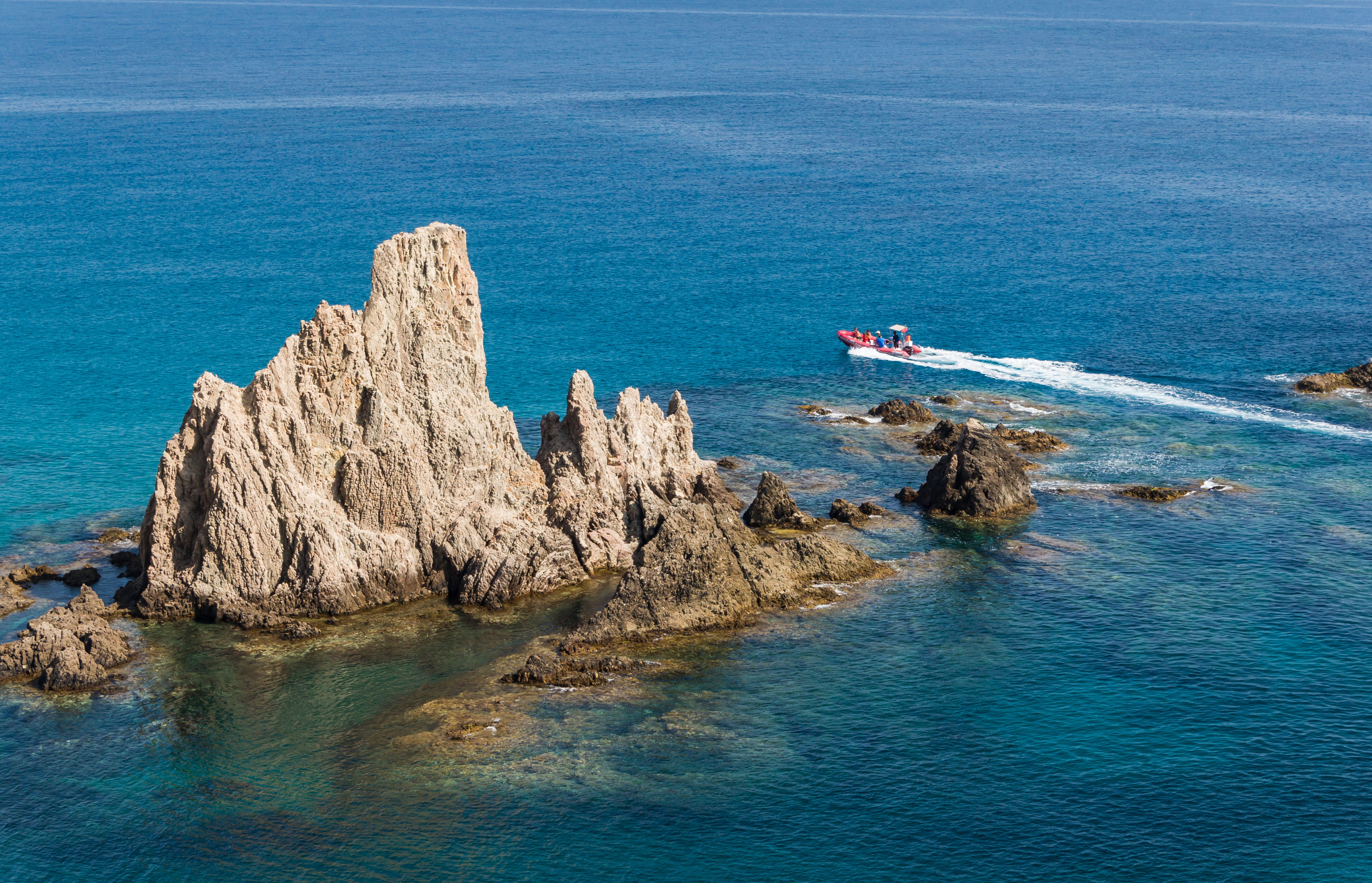 Inflatable boat, rocks, Cabo de Gata, Andalusia, Spain