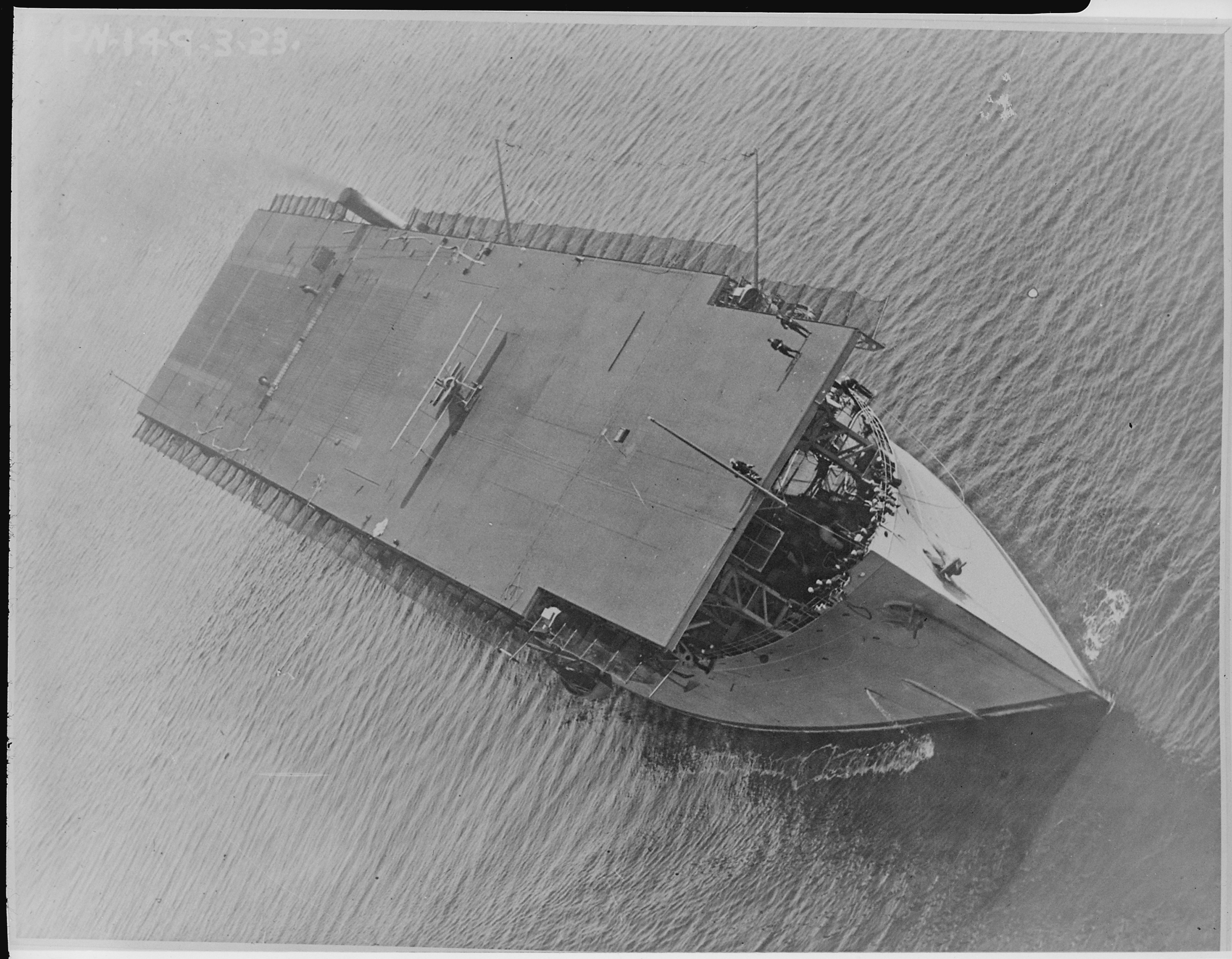 Langley (CV1), formerly the Jupiter. Aerial, bow on, plane on deck, 08-03-1923 - NARA - 520639
