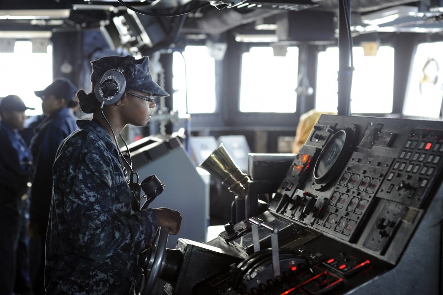 Defense.gov News Photo 101007-N-8335D-006 - U.S. Navy Seaman Rachel Mackey steers the amphibious dock landing ship USS Harpers Ferry LSD 49 through the Philippine Sea while forward deployed