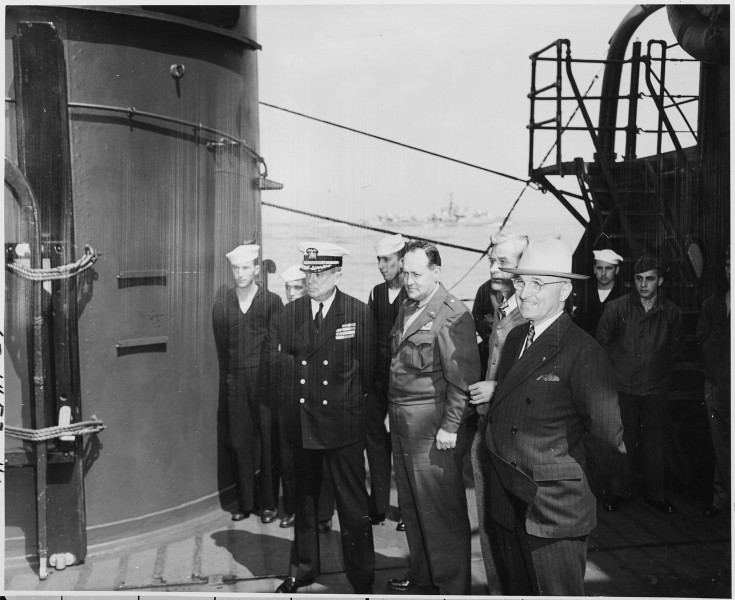 L to R, Captain James Vardaman, Gen. Harry Vaughan, Press Secretary Charles Ross, and President Harry S. Truman on... - NARA - 198721