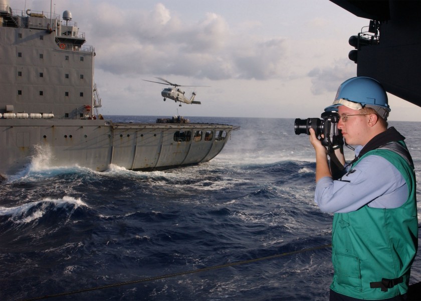 US Navy 020510-N-9610B-501 Navy Photographer documents a replenishment at sea