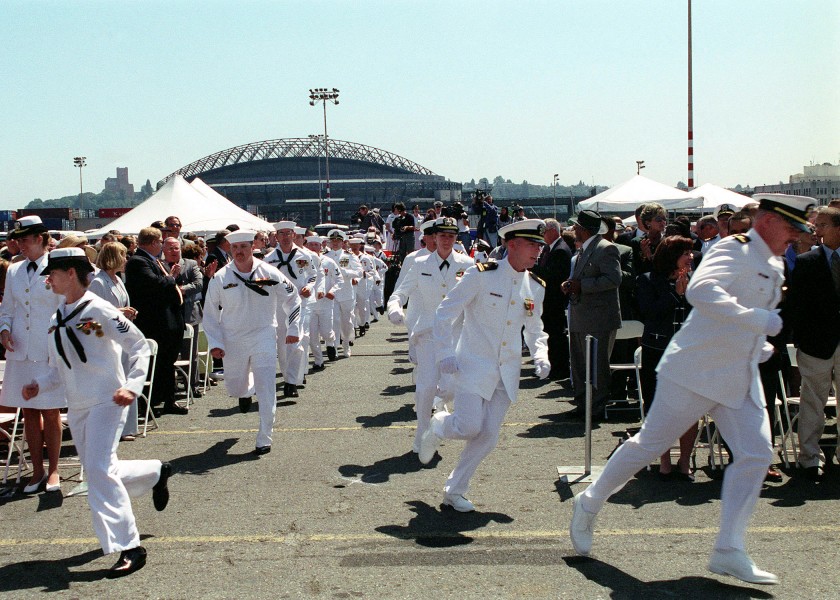 US Navy 020622-N-8252B-010 Sailors stationed aboard USS Shoup run to ^ldquo,man the rails^rdquo, during the commissioning ceremony