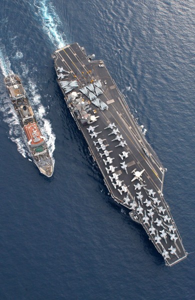 US Navy 030117-N-9851B-033 The Military Sealift Command (MSC) combat stores ship USNS Spica (T-AFS 9) steams alongside the nuclear powered aircraft carrier USS Harry S. Truman (CVN 75)