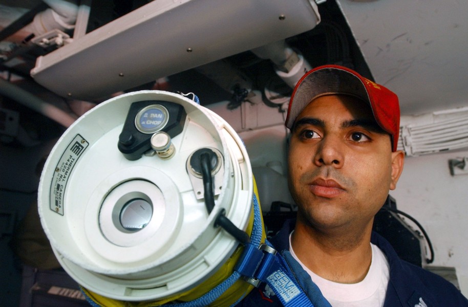 US Navy 030407-N-4953E-062 Damage Controlman 3rd Class Omar Ortega conducts an operational test on a Naval Firefighter Thermal Imagery (NFTI)