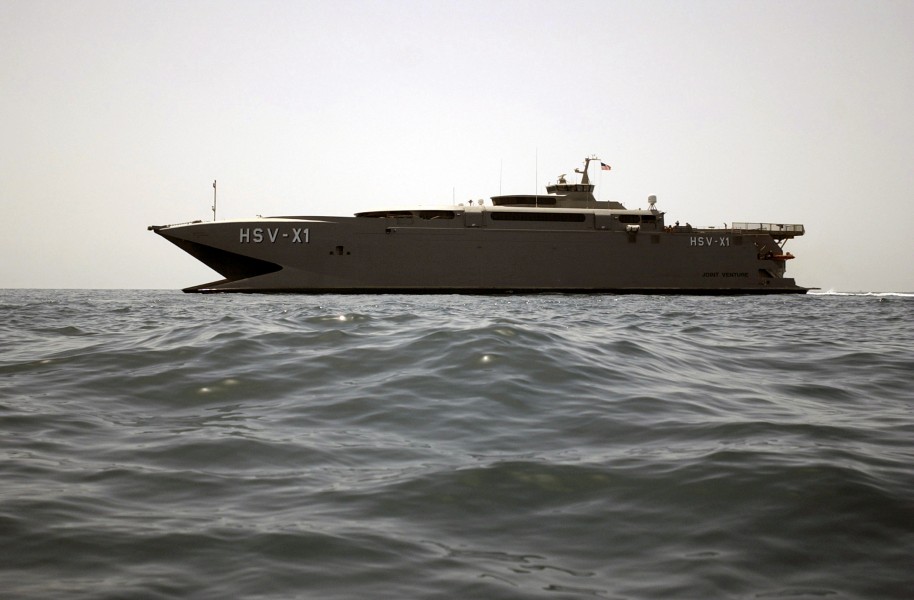 US Navy 030414-N-6141B-049 Joint Venture (HSX-V1) prepares to receive a small boat from the guided missile destroyer USS Mitscher (DDG 57) during underway operations