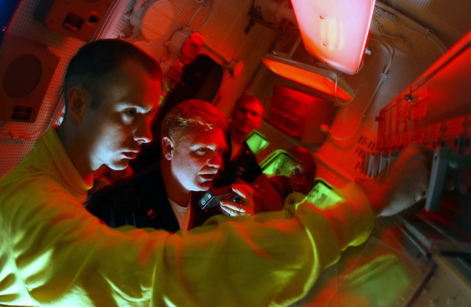 US Navy 030506-N-0696M-107 Aviation Boatswain^rsquo,s Mate Airman Jeremy Coon and the ship's fire marshal Chief Warrant Officer Stanley Flem test the Aqueous Film Forming Foam (AFFF) 