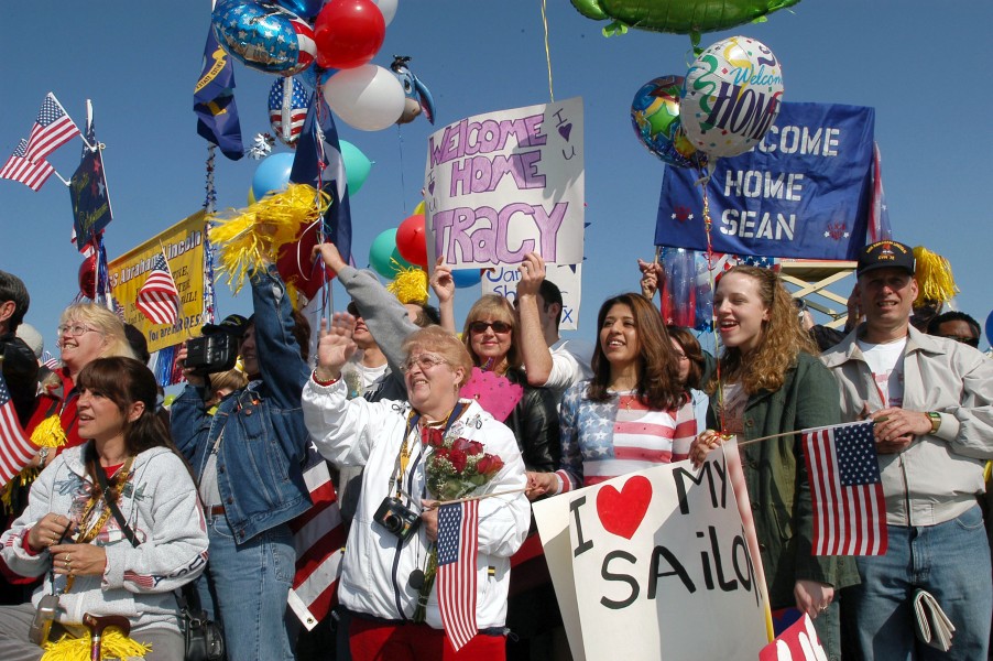 US Navy 030506-N-6901L-020 Family and friends gather on the pier to show their support as USS Abraham Lincoln (CVN 72) returned to its homeport of Naval Station Everett
