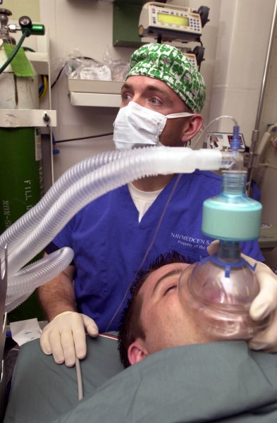 US Navy 030513-N-1577S-001 Lt. Cmdr. Joe Casey, Ship^rsquo,s Anesthetist, trains on anesthetic procedures with Hospital Corpsman 3rd Class Eric Wichman aboard USS Nimitz (CVN 68)