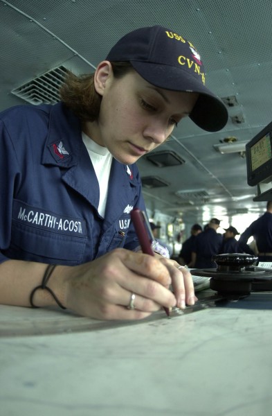 US Navy 030517-N-1577S-002 Quartermaster 2nd Class Graham Acosta plots the position of the ship while standing Quartermaster of the Watch (QMOW) aboard USS Nimitz (CVN 68)