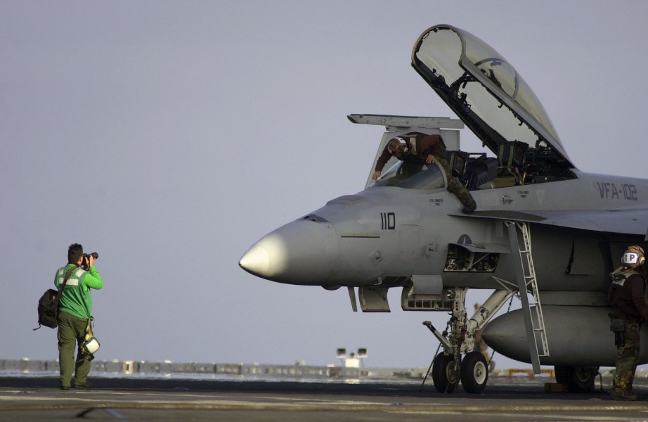 US Navy 030807-N-6213R-375 Photographer's Mate Airman Charles Whetstine, of Los Angeles, Calif., photographs an F-A-18F Super Hornet on the flight deck of USS John C. Stennis (CVN 74)