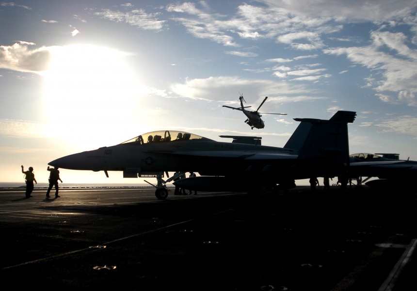 US Navy 030811-N-1573O-028 An SH-60F Seahawk helicopter takes off from the flight deck of the USS John C. Stennis (CVN 74) as an F-A-18F Super Hornet prepares to launch