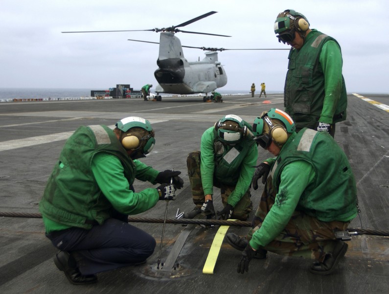 US Navy 030923-N-6213R-010 change arresting wire springs on the flight deck of USS John C. Stennis (CVN 74)