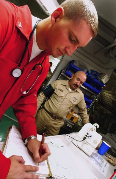 US Navy 030924-N-9769P-045 records the vital signs 