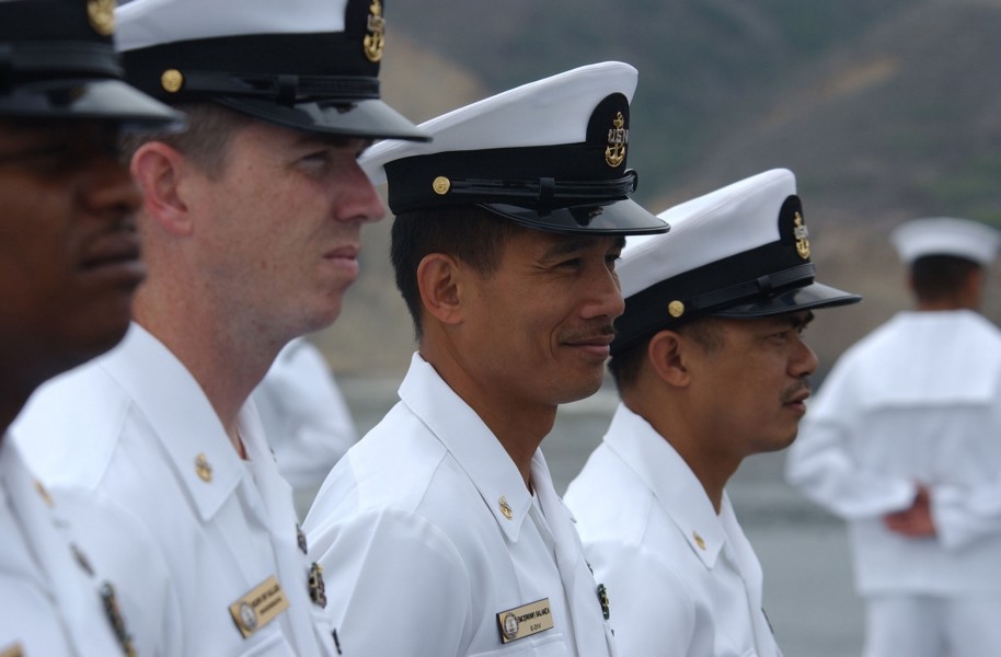 US Navy 031004-N-4768W-118 Chief Petty Officers man the rails of USS John C. Stennis (CVN 74) as the ship arrives in port for the annual San Diego Fleet Week parade of ships ceremony