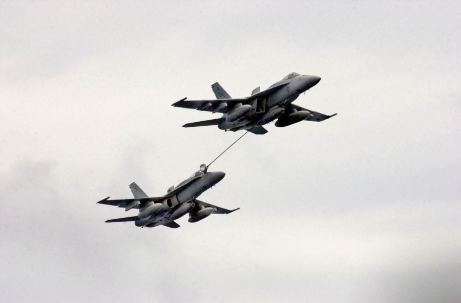 US Navy 031005-N-2143T-002 Two F-A-18 Hornets refuel