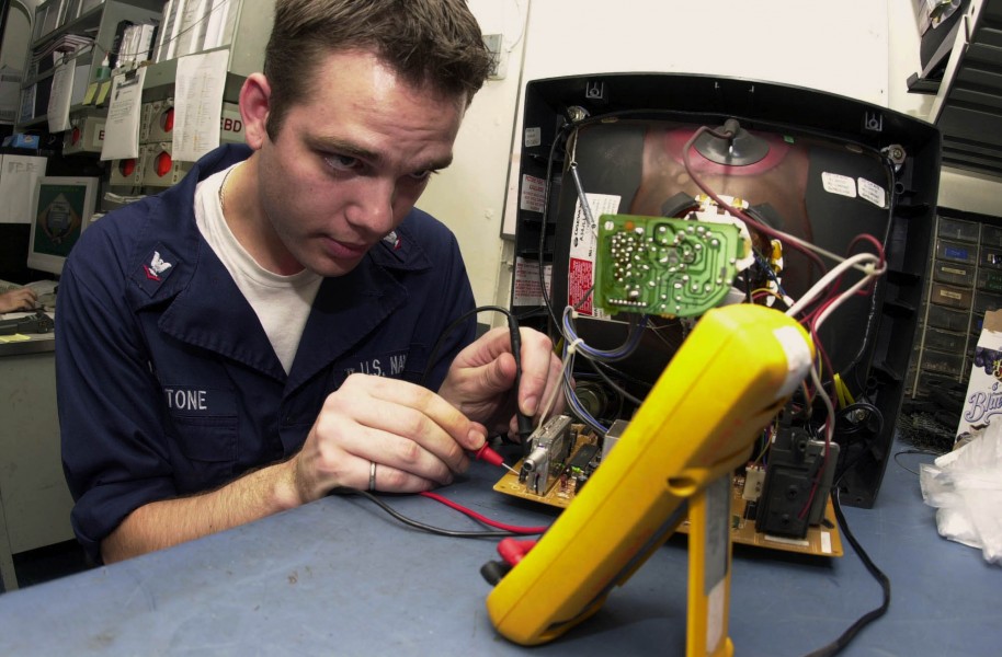 US Navy 031016-N-2143T-002 Interior Communications Electrician 3rd Class Jonathan Livingstone from St. Louis, Mo., takes resistance readings on wires