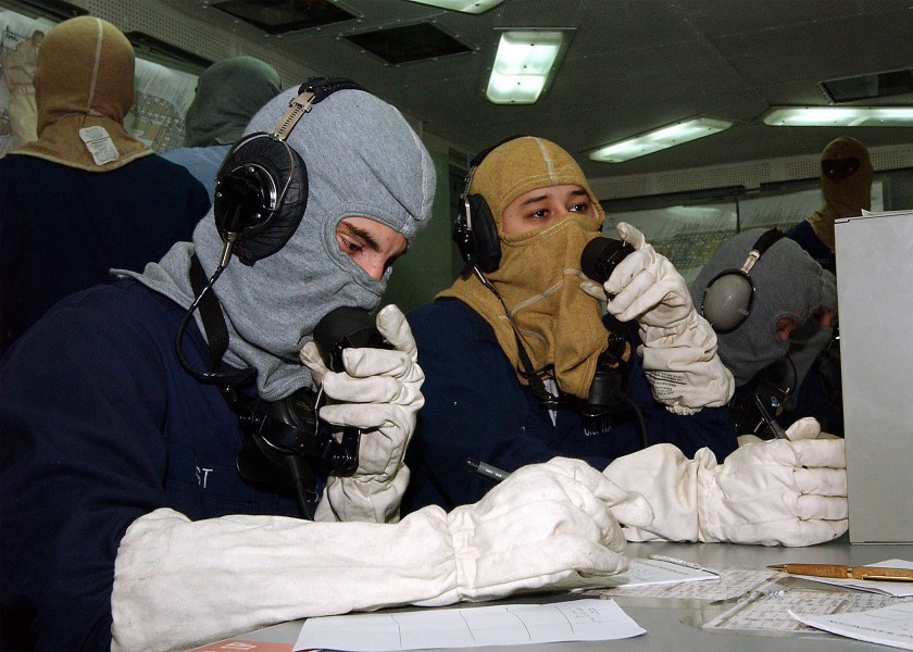 US Navy 031022-N-1127G-002 Sailors man the sound powered phones in Damage Control Central 