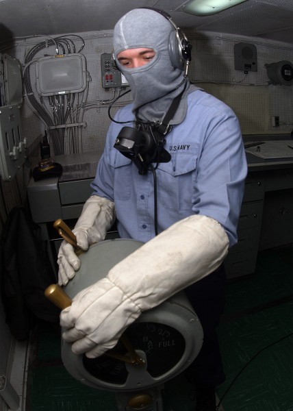 US Navy 031022-N-6653C-002 Boatswain^rsquo,s Mate Seaman Mark Maguire, from Southington, Conn., sets all engines ahead one-third