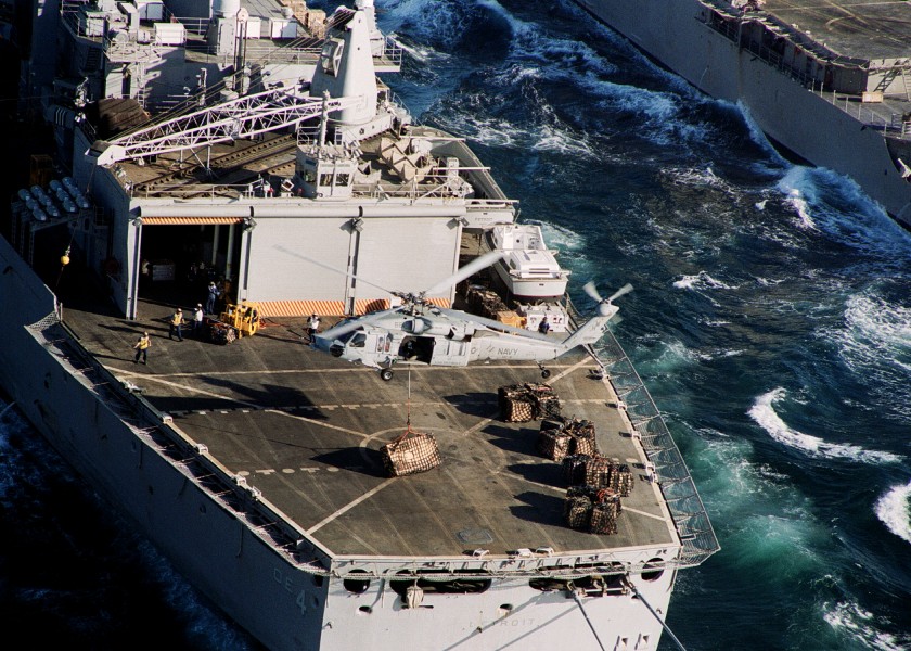 US Navy 031111-N-6259P-012 An MH-60S sets a crate on the deck of USS Detroit (AOE 4)